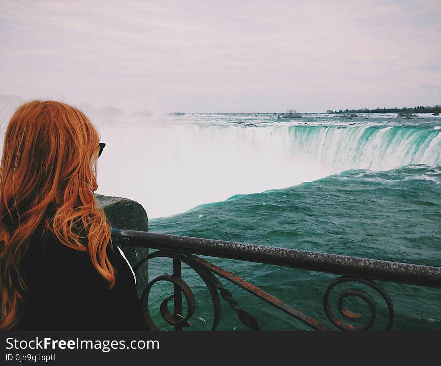 Woman Standing Near of Niagara Falls