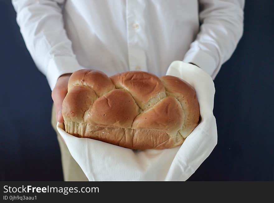 Brown Bread Held by a Person