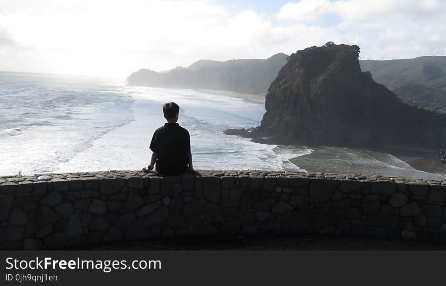 Boy Sitting on the Wall