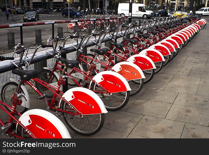 Parked Red and White Bicycles