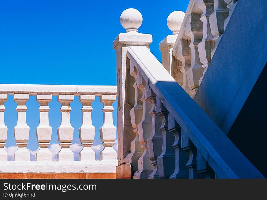 Shallow Focus Photography of White Hand Rails