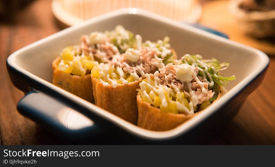 Three Tacos on Black And White Ceramic Bowl