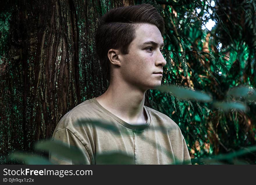 Man Wearing Brown Shirt Near Tree