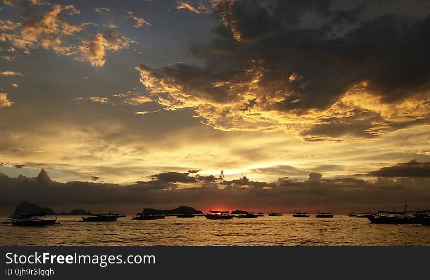 Silhouette of Ships during Sunset