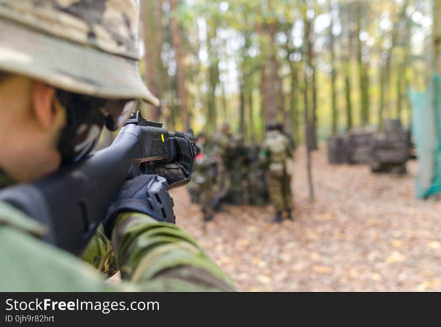 Soldier Holding Black Assault Rifle