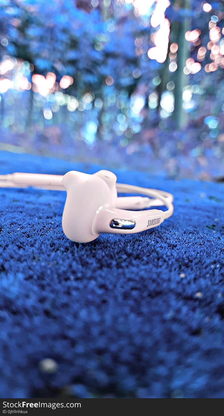 Shallow Focus Photography of White Samsung Earphones