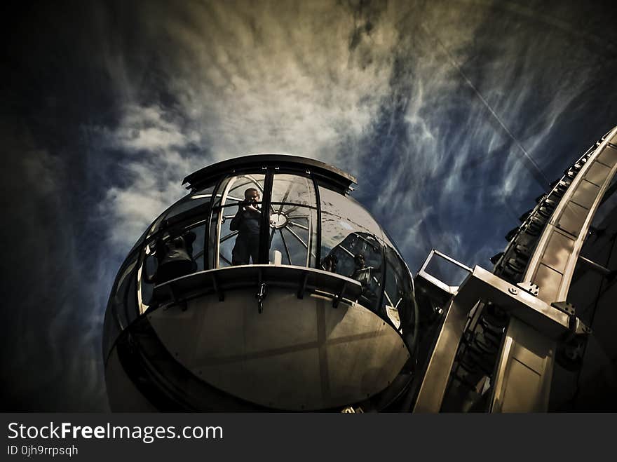 Low Angle Shot Of Man Looking At The Window