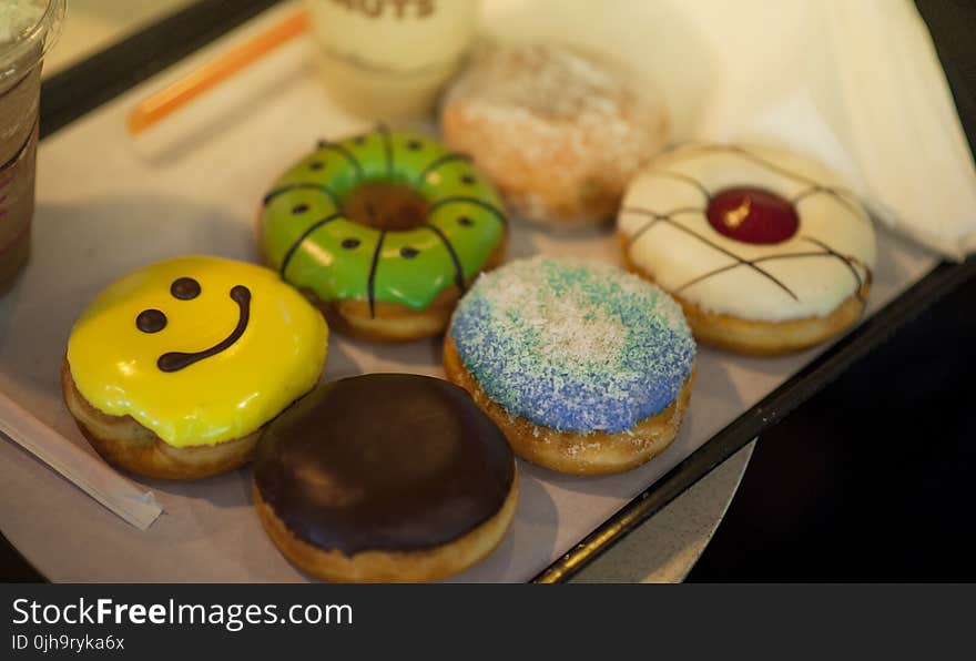 Shallow Focus Photography of Assorted Flavored Donuts