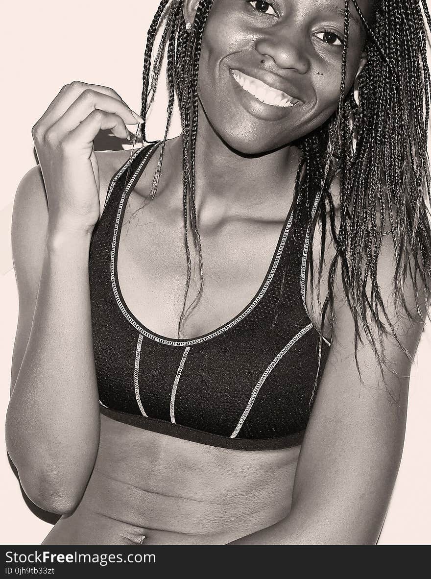 Woman in Sport Bra With Braided Hair Grayscale Photo