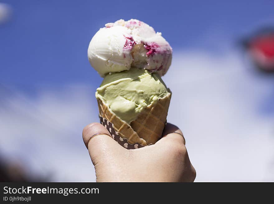 Person Holding Ice Cream With Cone