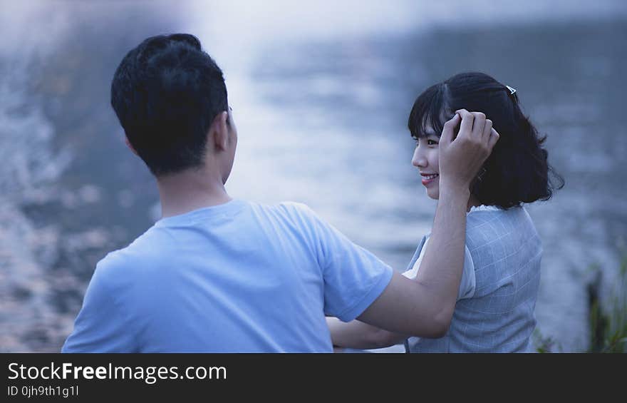 Man and Woman Wearing Shirt Shallow Focus Photography