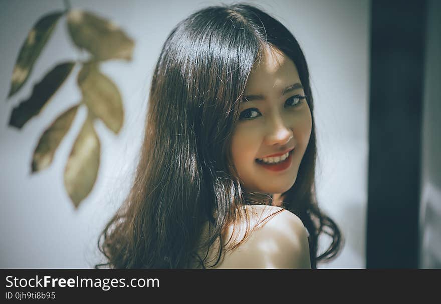 Woman with Black Long Hair Smiling