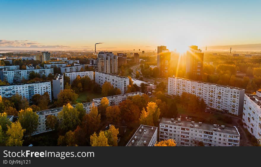 Aerial View of White Concrete Buildings during Golden Hours