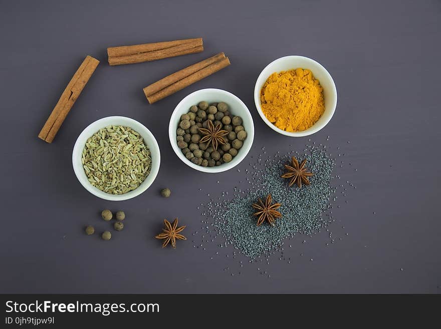 Assorted Spices Near White Ceramic Bowls