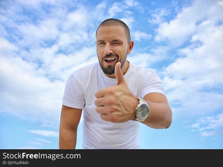 Black Haired Man in White Crew Neck T-shirt