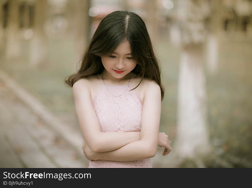 Shallow Focus Photography of Woman in Pink Dress