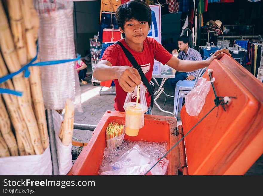 Man Holding Plastic Cup