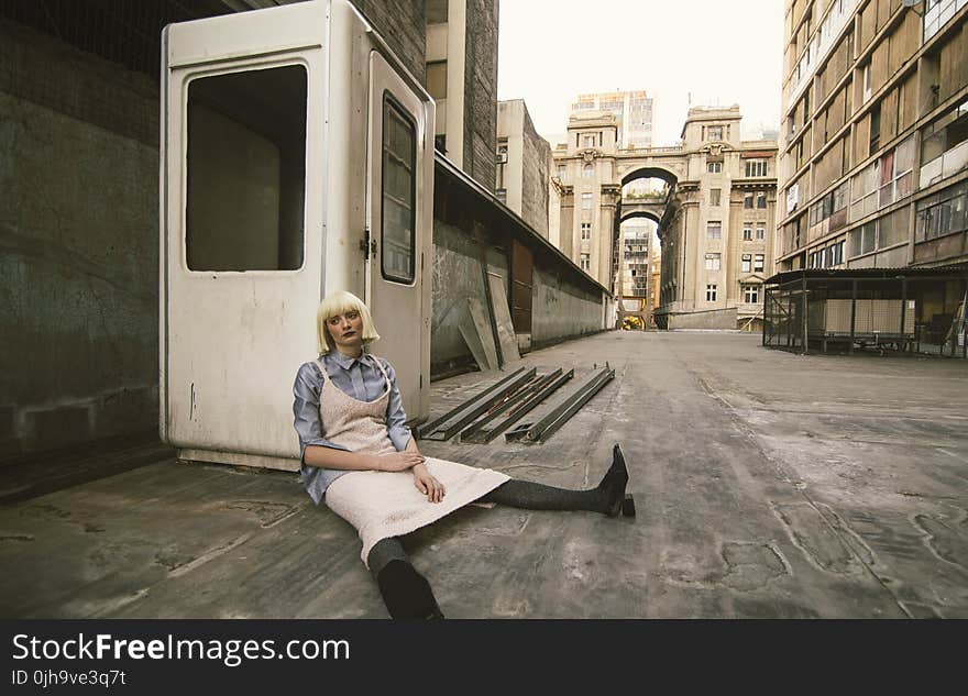 Woman Sitting on Road