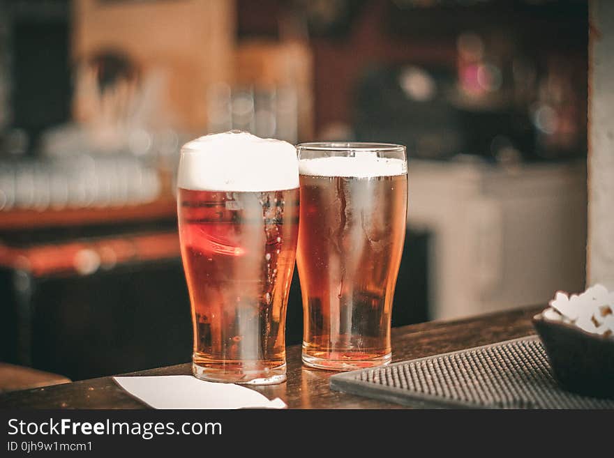 Depth of Field Photo of Two Pilsner Glasses