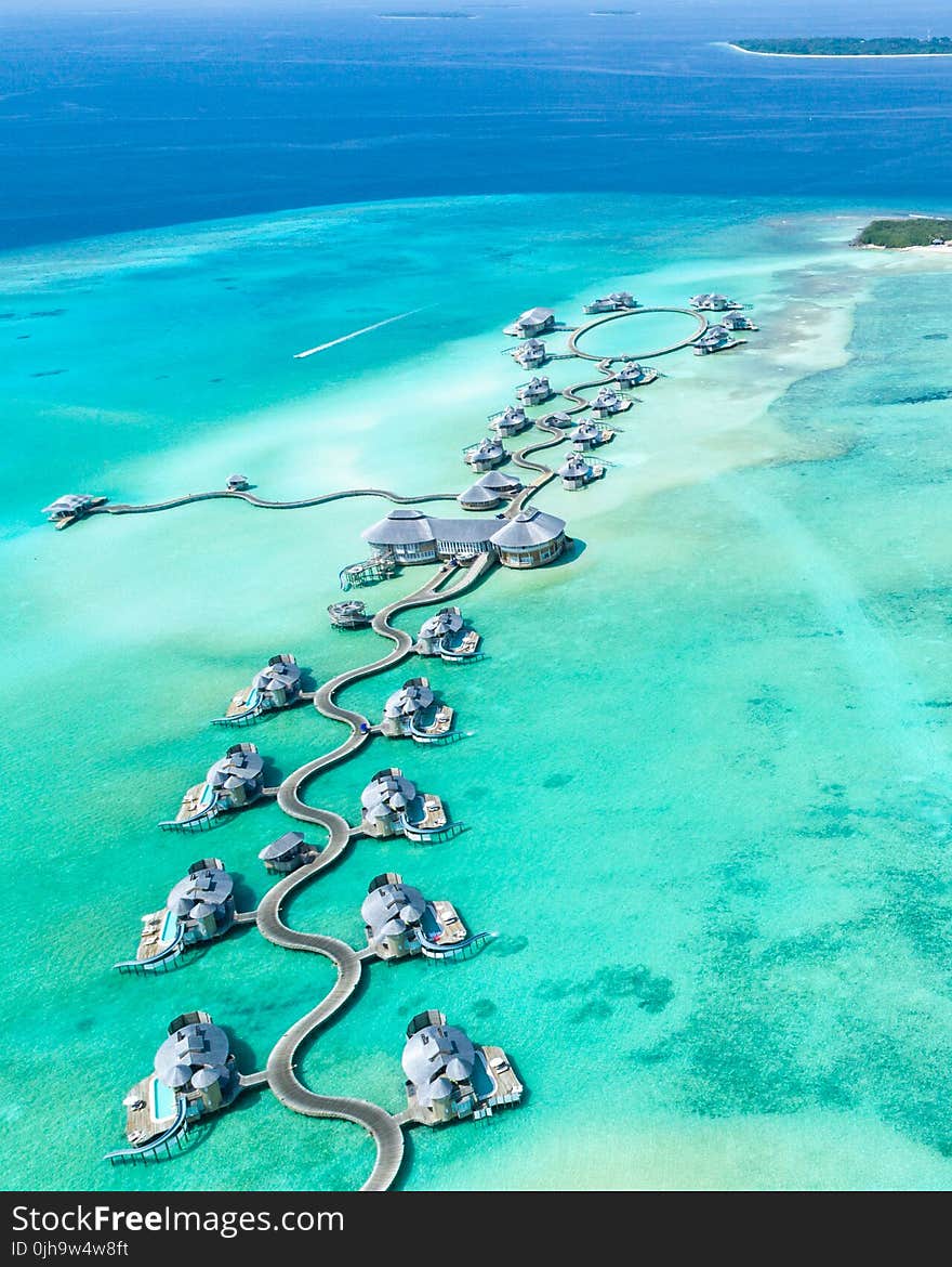 Aerial Photography of Island With Cottages Surrounded With Water