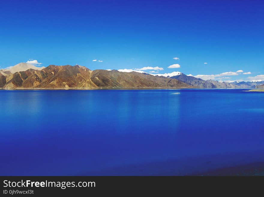 Body of Water Near Mountain Hills