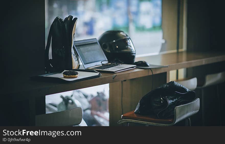 Gray Laptop Near Black Full-face Helmet