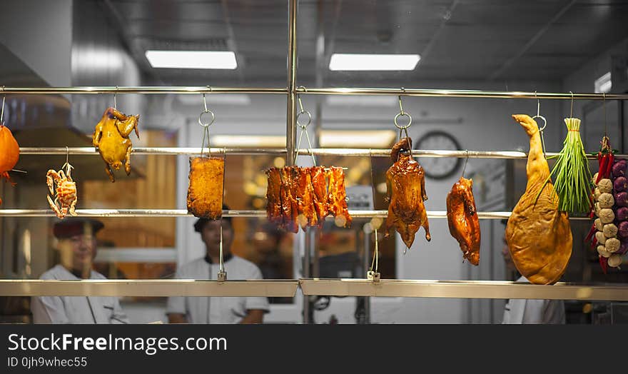 Photo of Assorted Food Hanging on Gray Metal Railings