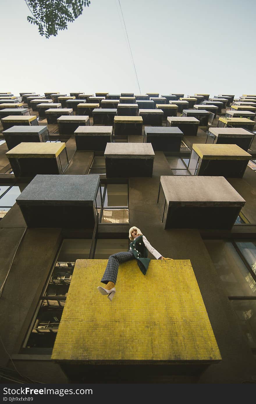 Woman On A Building Balcony