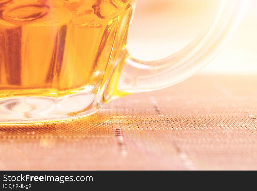 Closeup Photography of Clear Glass Beer Mug Filled With Yellow Liquid