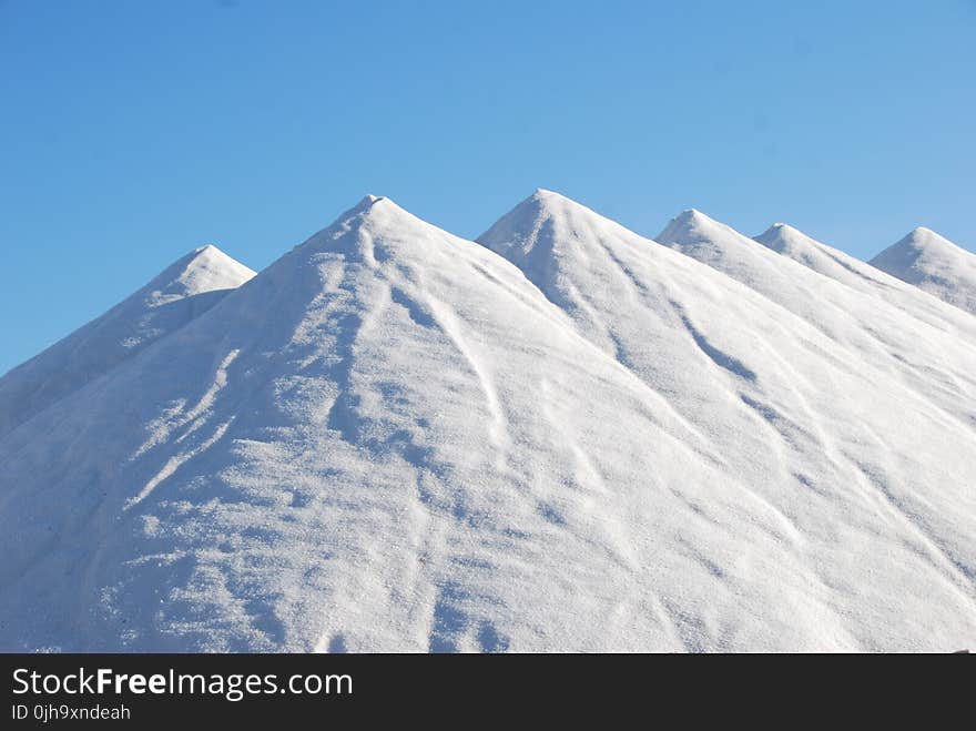 Snow Covered Mountain Under Blue Sky at Daytime