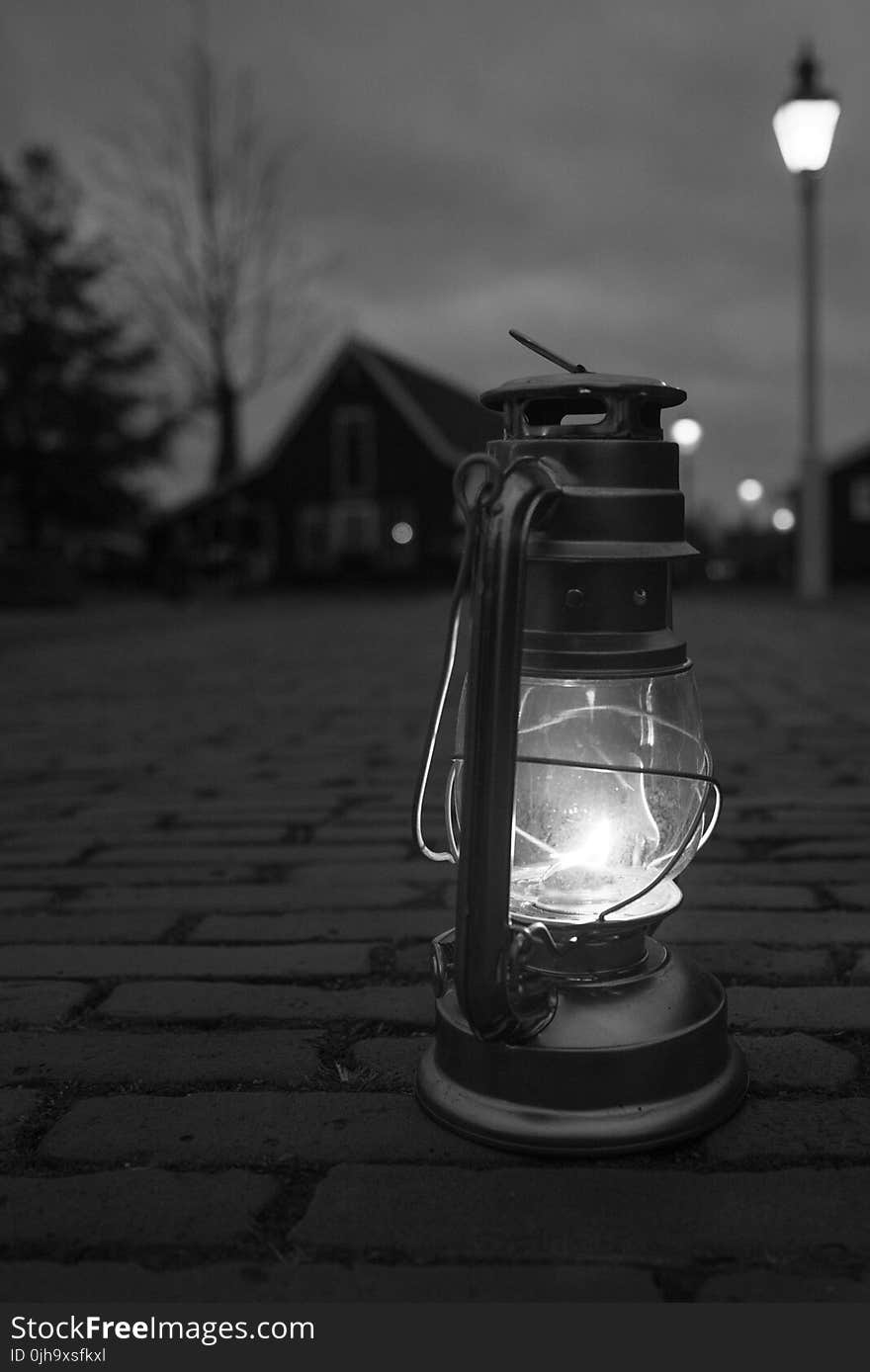 Greyscale Photography Of Lamp On Floor