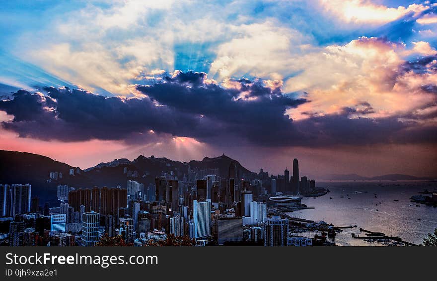 Scenic View of the City Under Cloudy Sky