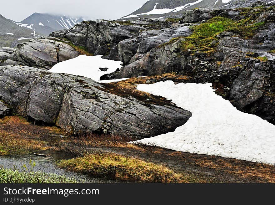 Gray Stone Surrounded by Snow