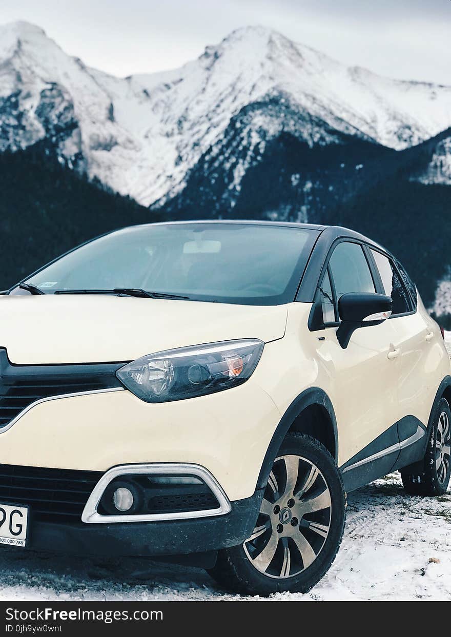 White Renault Clio 4 on Snow Covered Road