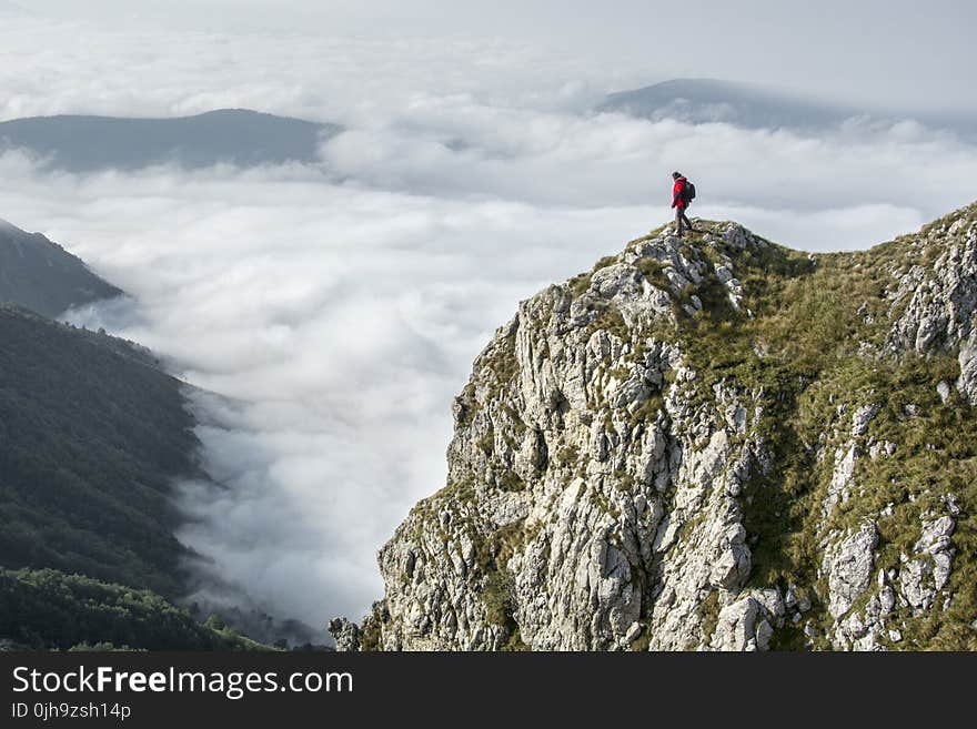 Photography of Person on Green Mountain