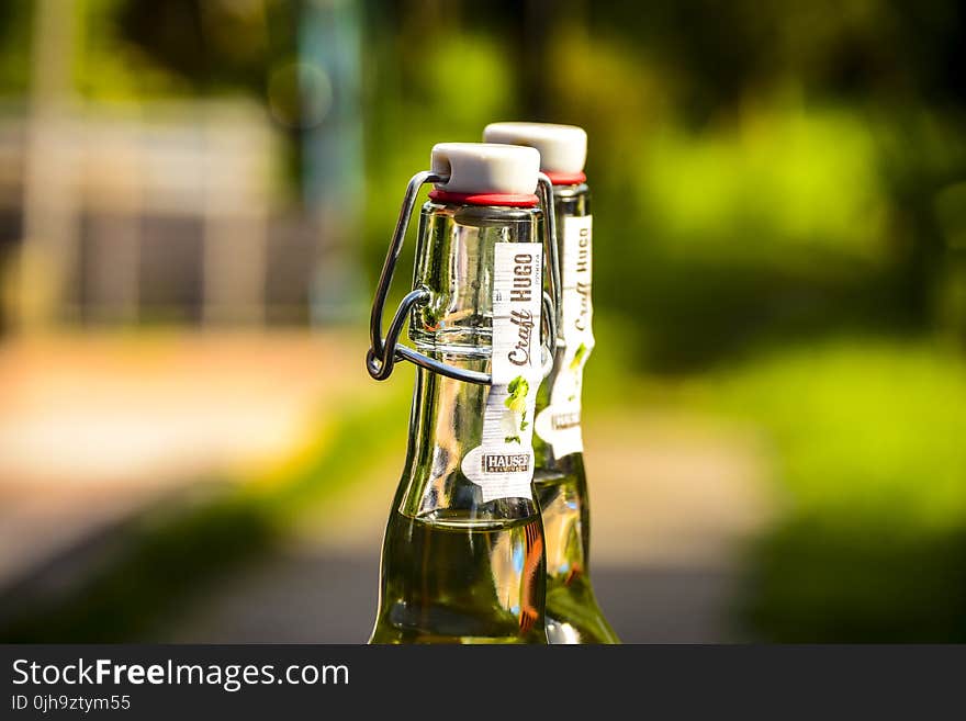 Selective Focus Photography of Two Clear Air Tight Bottles