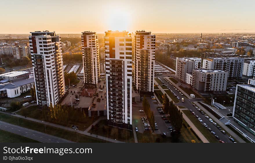 High Angle Photography of High-rise Buildings Near Road during Golden Hour