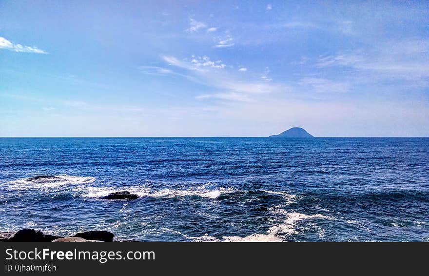 Seashore Under Blue Sky