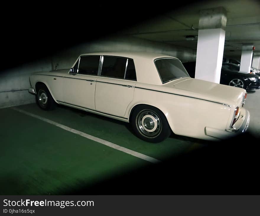 Photography of Vintage Car Parked on a Parking Lot