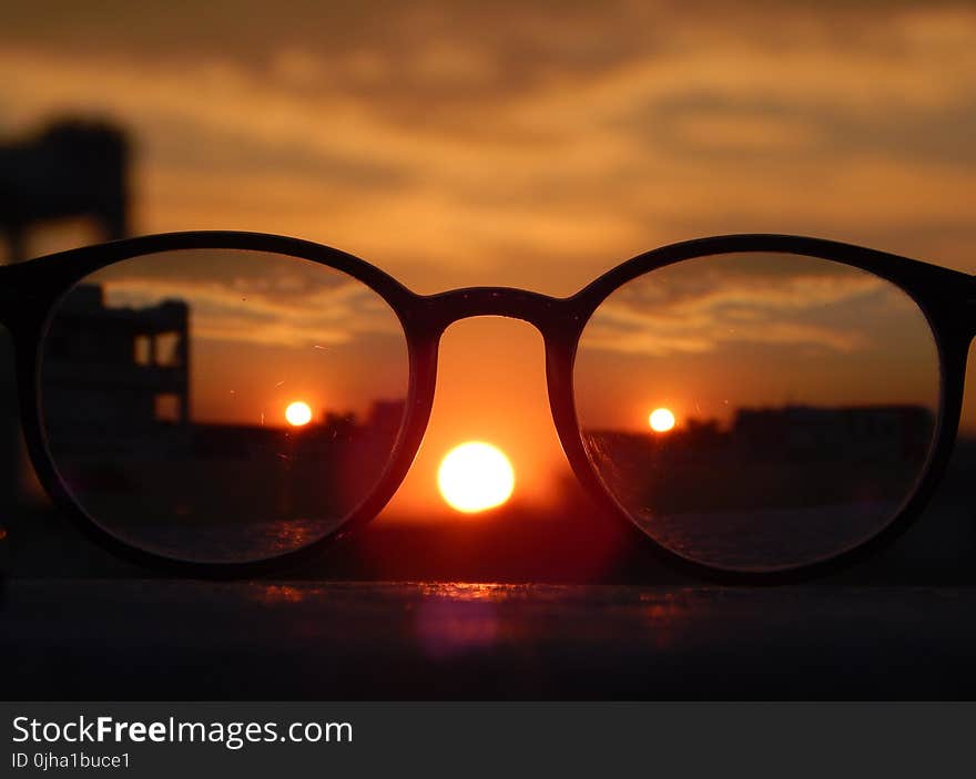 Close-up Photography of Eyeglasses at Golden Hour