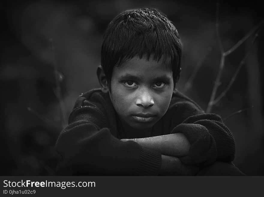 Grayscale Photo of Boy in Long-sleeved Shirt