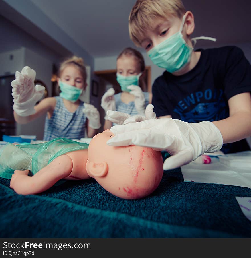 Three Children Playing Operation Toy