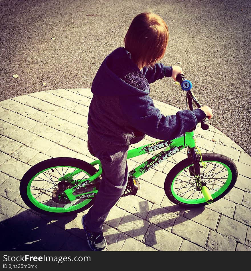 Boy Riding Bike at Daytime