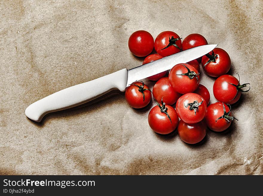 Tomatoes With Knife on Brown Surface