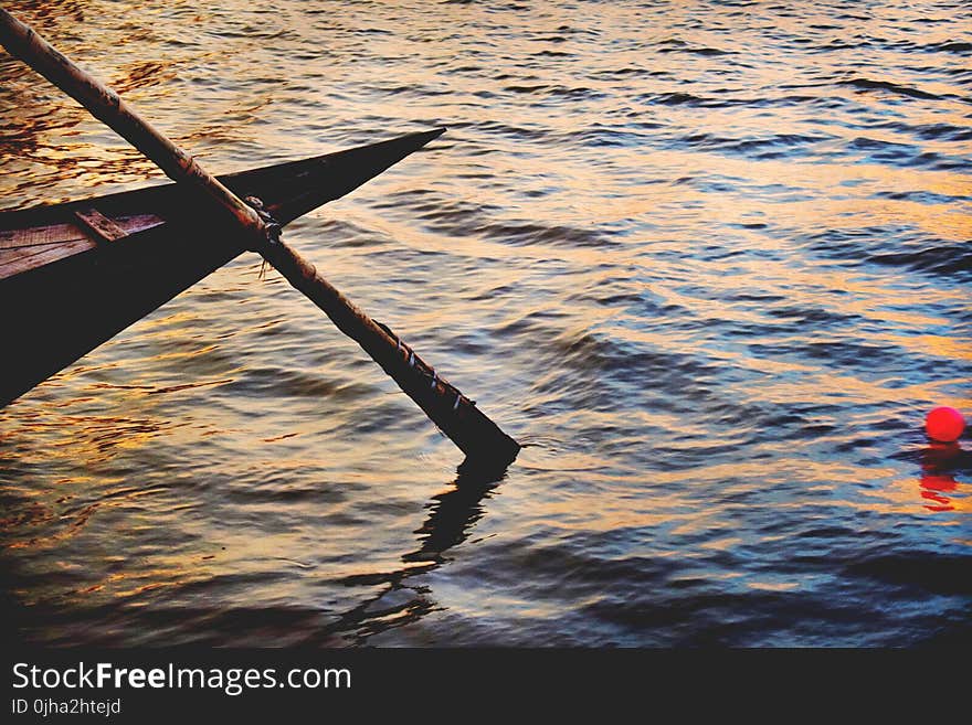 High Angle Photo of Brown Boat Paddle