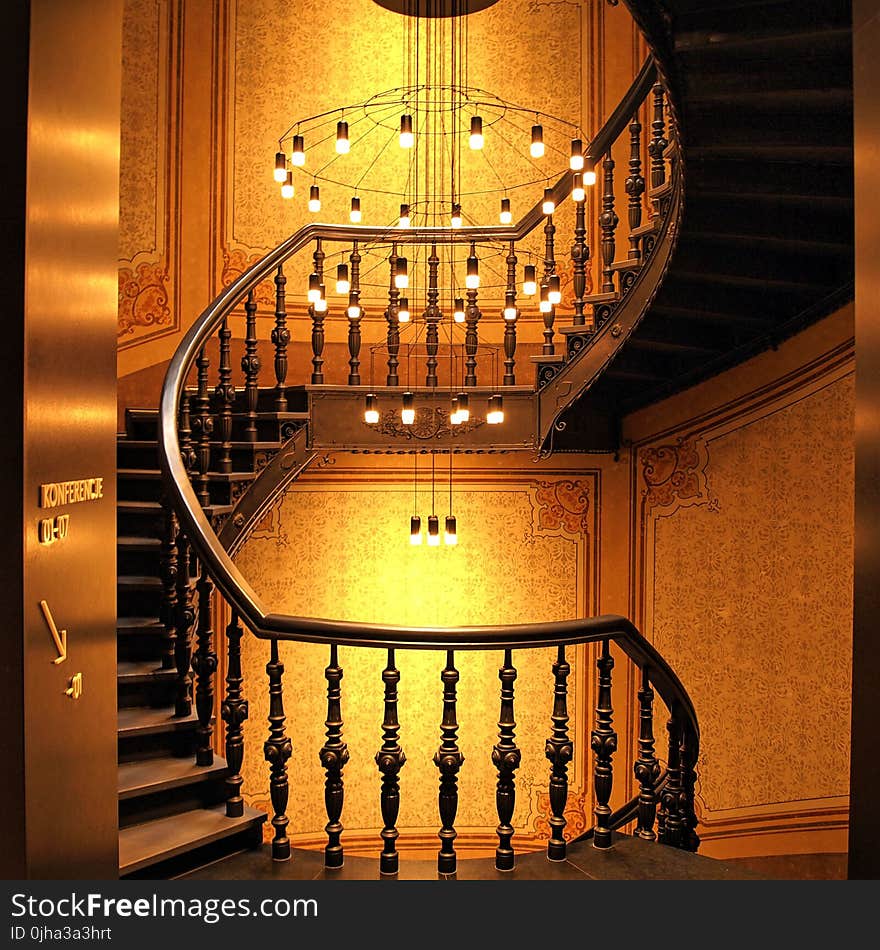 Brown Wooden Stairs and Chadelier