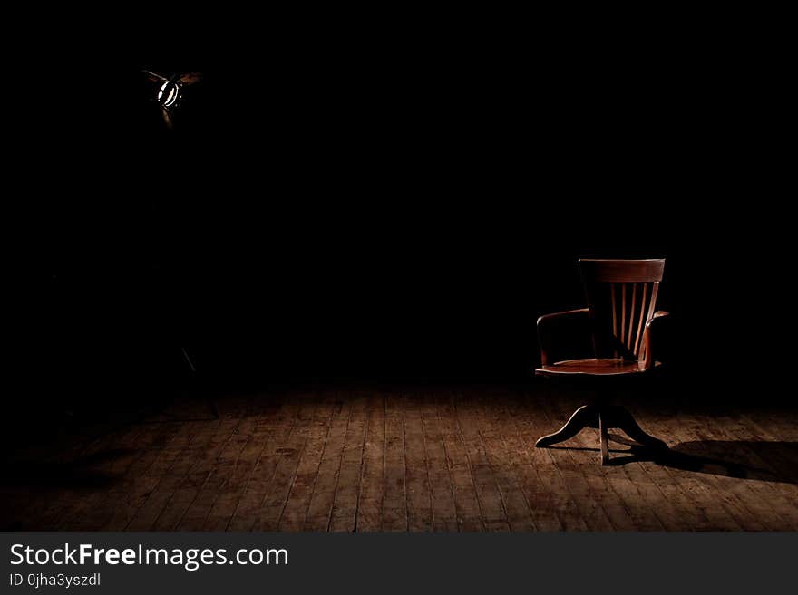 Brown Wooden Armchair on Brown Wooden Floor