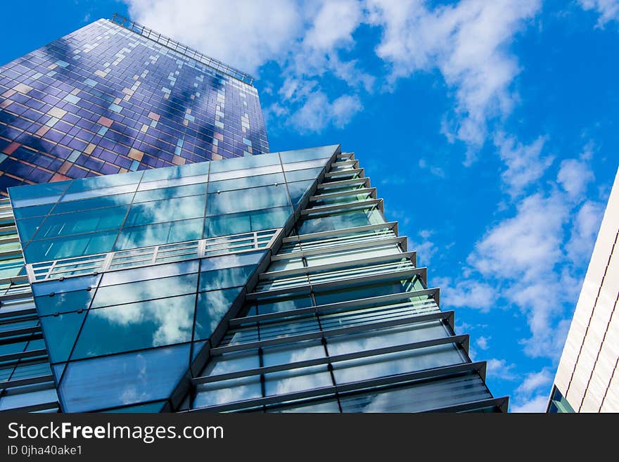 Glass Building Panels Under Blue Sky