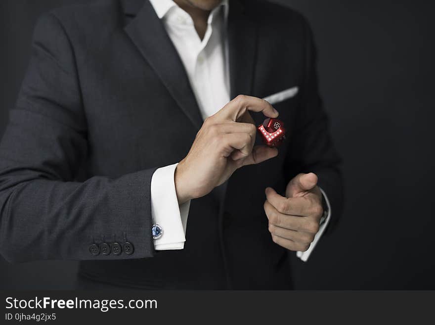 Man Holding Red Cube