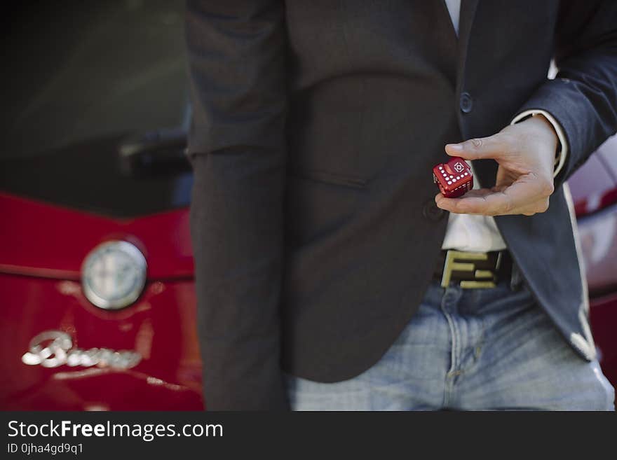 Person Holding Red Cube